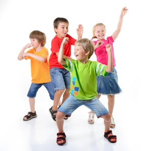 four kids dancing