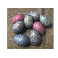 colored eggs with dragon scale designs