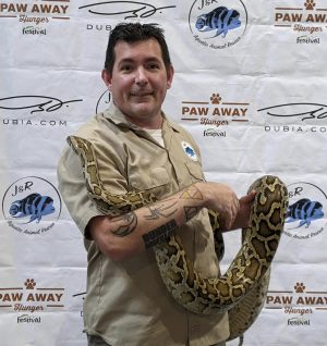 man holding large snake