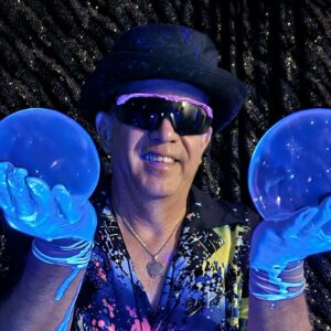 man holding a large bubble in each hand