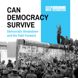 Berlin wall taken down piece-by-piece while people stand on top