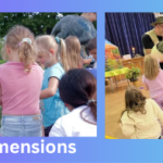 children around man holding realistic dinosaur puppet